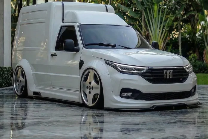 Fiat Fiorino branca rebaixada em conceito, vista em três quartos dianteiro sobre piso de pedra polida.