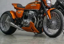 Honda CB 750K: o resgate da moto que inventou a superbike, por IA Honda CB 750 laranja metálico em conceito custom, vista lateral em três quartos dentro de uma oficina.